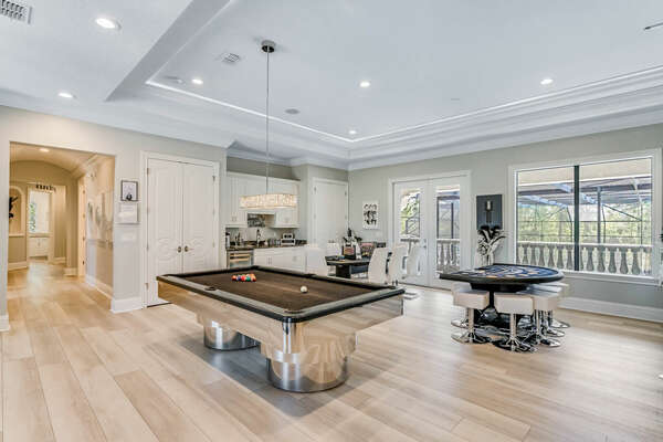 The second floor loft area features 8 ft custom slate pool table and card table that seats 8