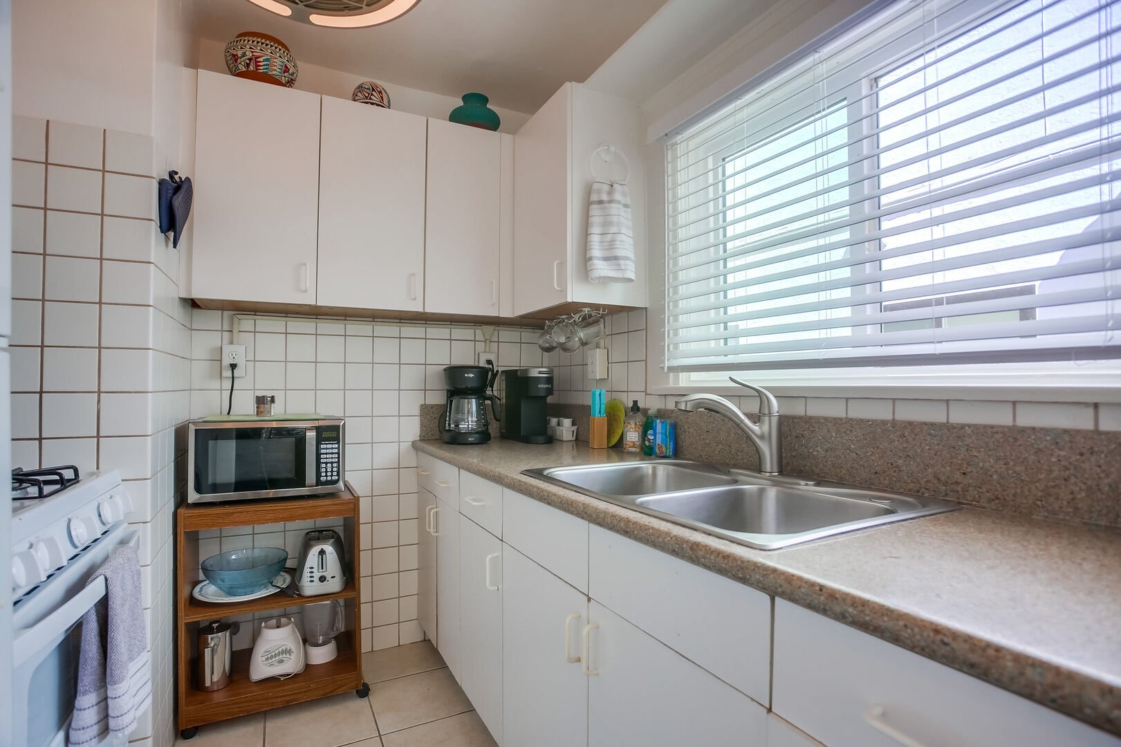 Fully equipped kitchen with microwave, stove, oven, refrigerator, freezer, coffee maker, cookware and bakeware. Please note: there is no dishwasher