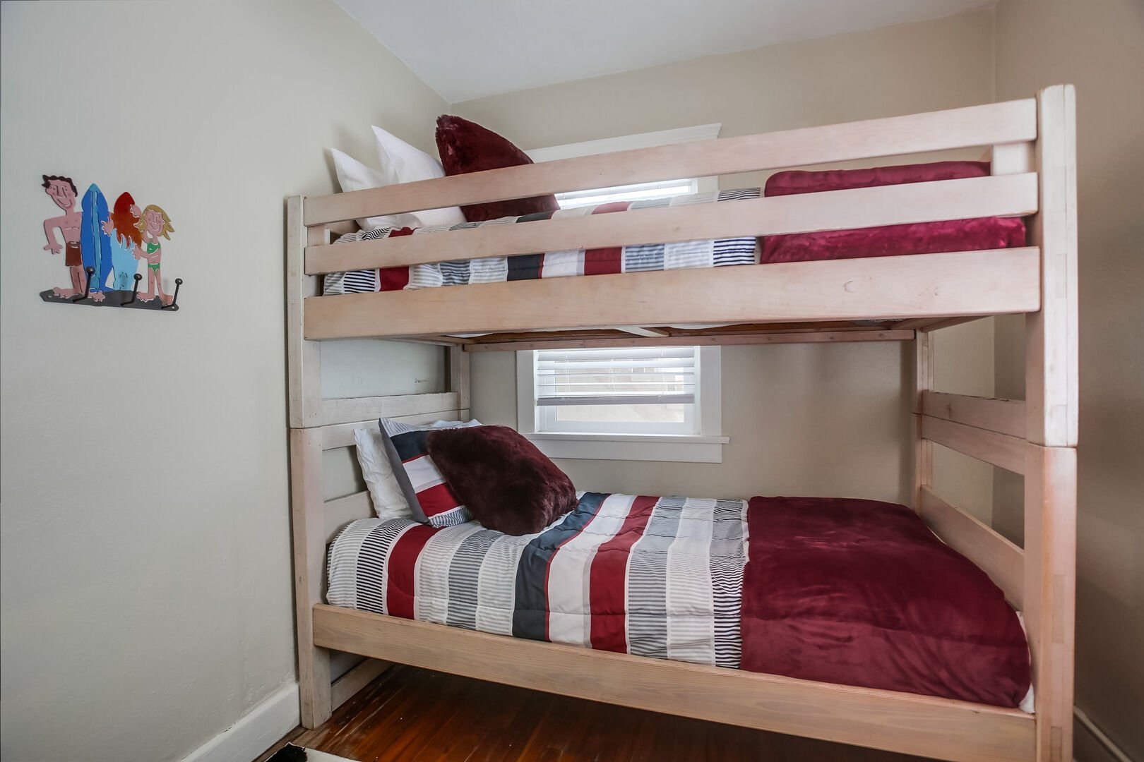 Guest bedroom with twin size bunk beds, there is also a blade-less ceiling fan