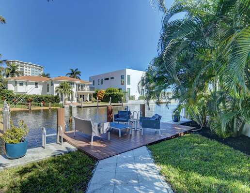 Tranquil waterside seating in the rear yard