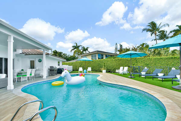 Heated Pool with sun loungers, shade, inflatables and privacy.