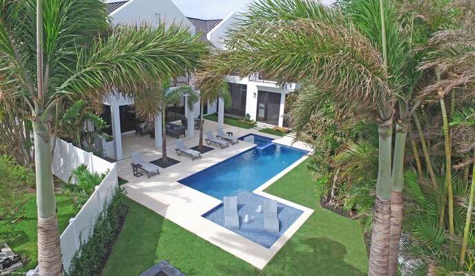 Private rear yard, tropical planting, a stunning home in every respect