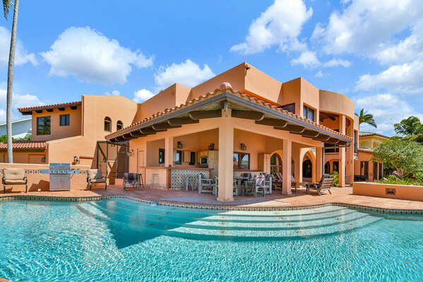 Large heated pool with expansive patio area and seating options to suit every taste.