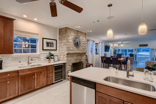 Expansive Kitchen with Stainless Steel Appliances, including a Wine Fridge