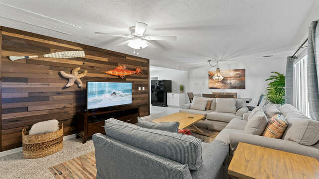 Living space with comfy couches and flatscreen TV