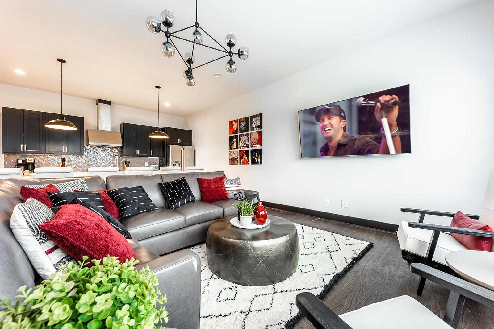 Unit 1: Bright and open living area with designer furnishings and smart TV.