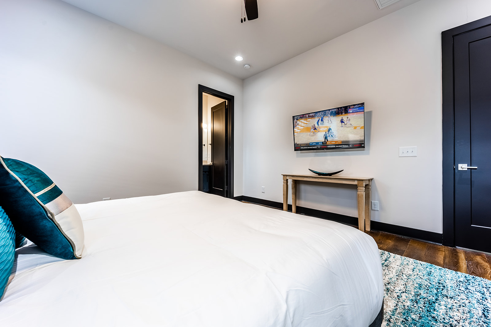 Unit 3: Master Bedroom with King bed, smart TV, and en-suite bathroom.