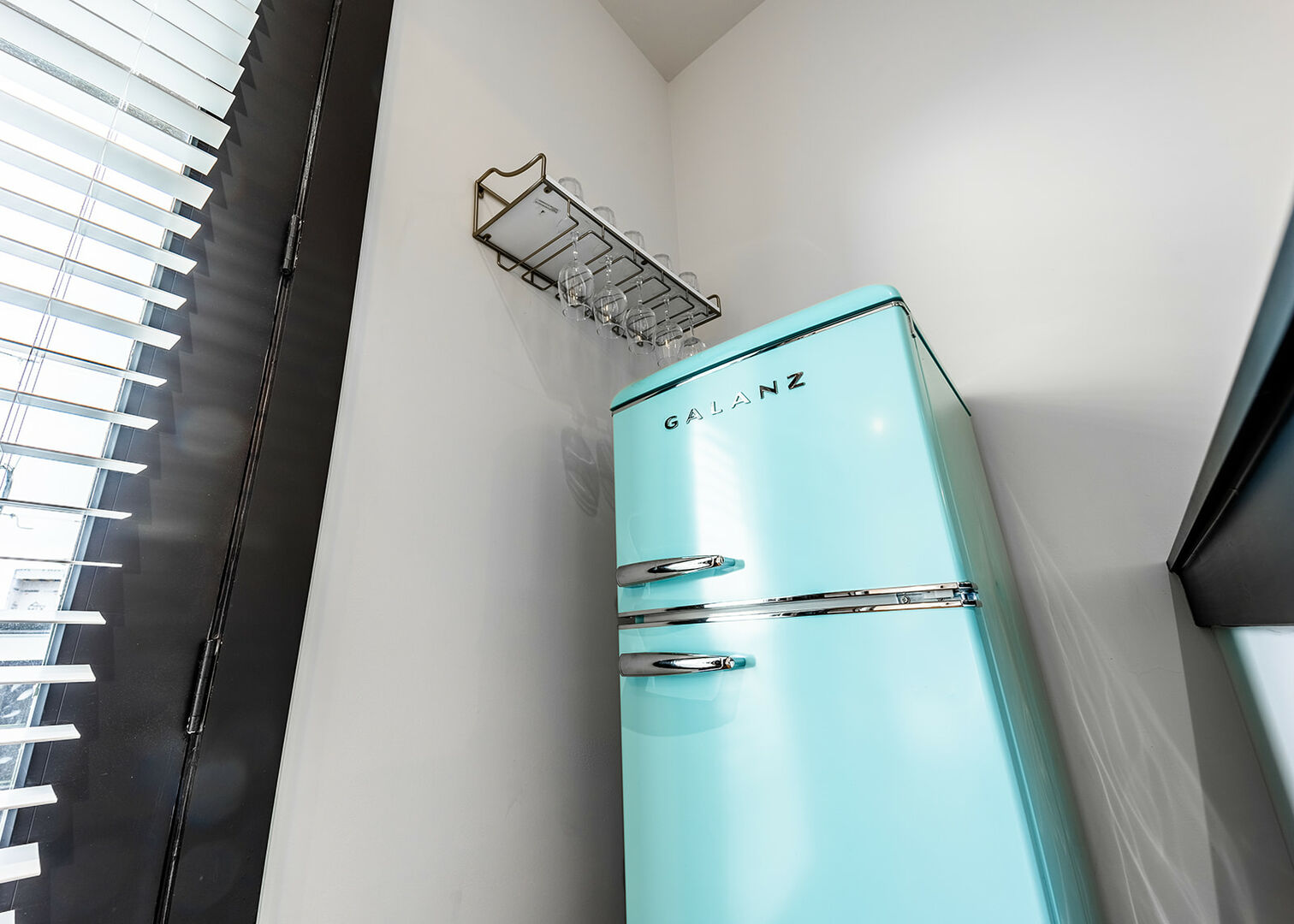 Unit 3: Designer fridge with wine glass rack.