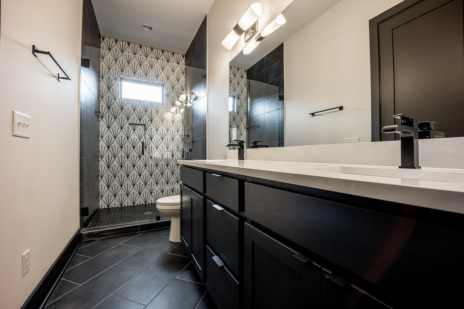 Unit 3: Master bathroom with dual vanity and walk in shower.
