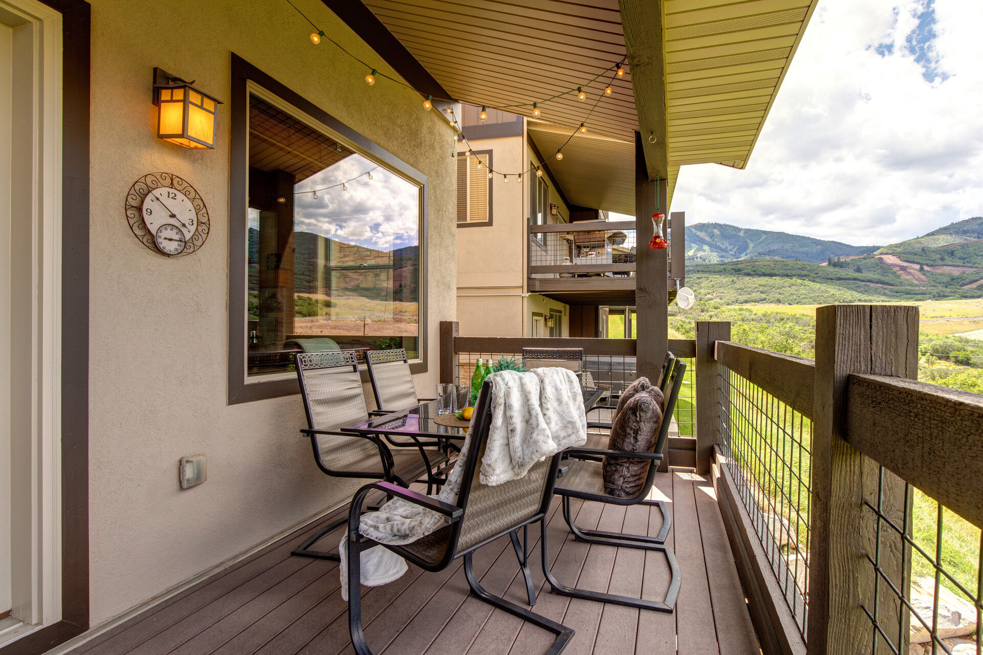 Main Level Private Deck with BBQ grill, outdoor table for 6, and breathtaking views of the Jordanelle and Deer Valley Resort