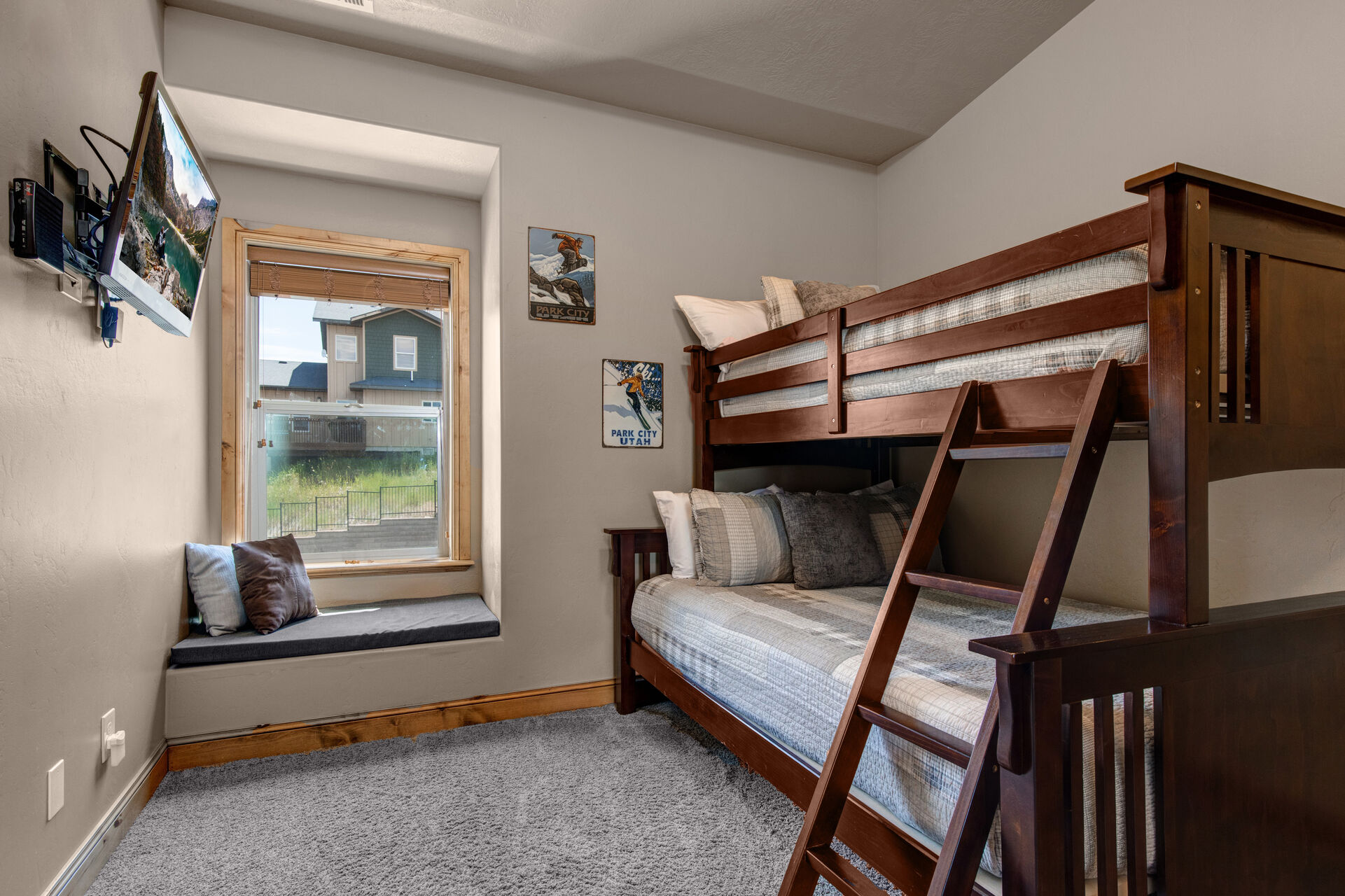 Upper Level Bedroom 3 Bunk Room with twin over full bunkbed and twin trundle bed, TV, and full bath access