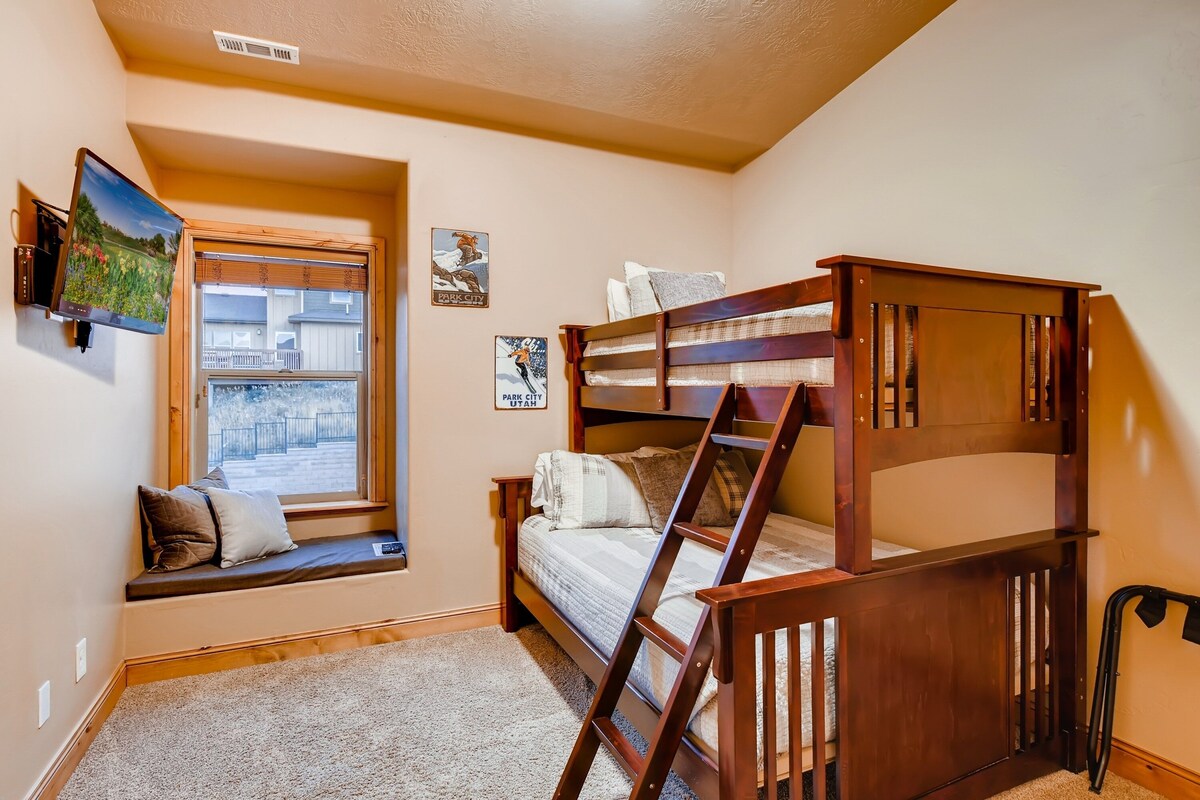 Upper Level Bedroom 3 Bunk Room with twin over full bunkbed and twin trundle bed, TV, and full bath access