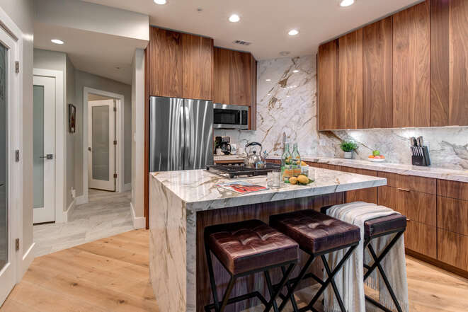 All New Kitchen with a Waterfall Counter Center Island