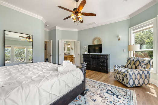 Spacious Master Bedroom with a Smart TV