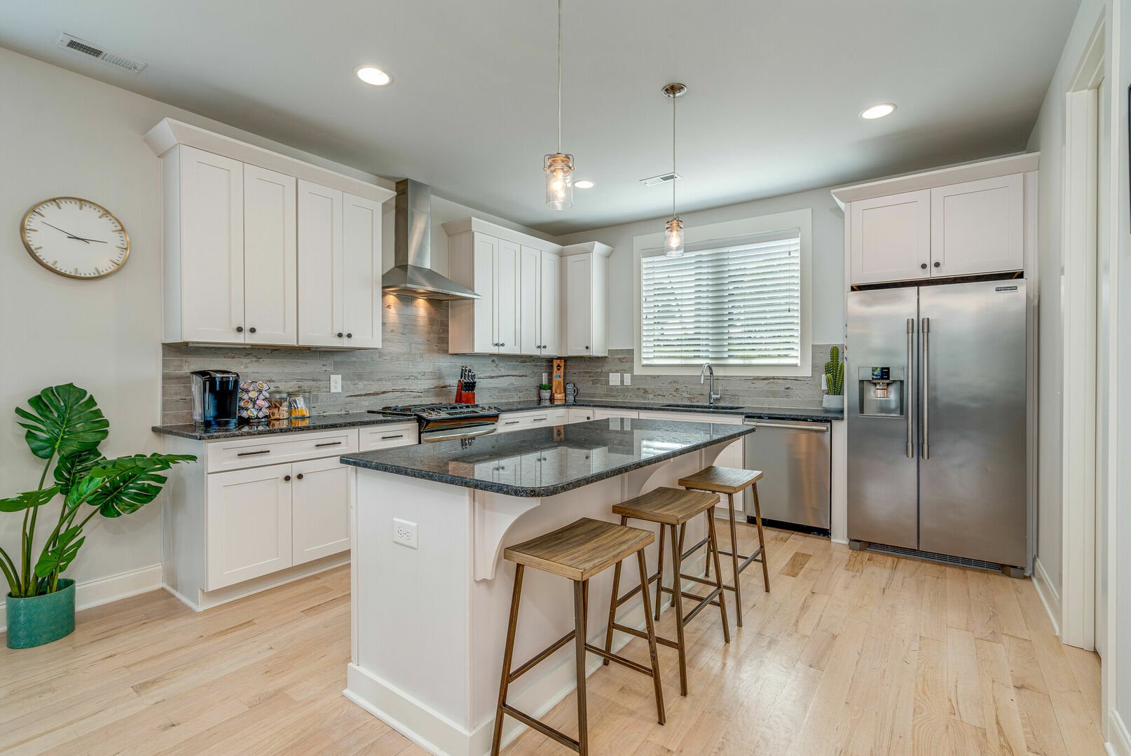 Gourmet kitchen with stainless steel appliances, breakfast bar seating, and is fully stocked with all your basic cooking essentials.