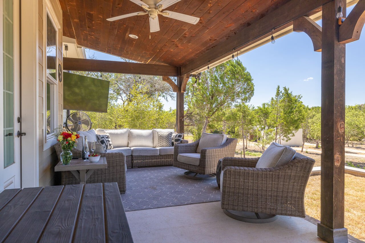 Covered Back Patio with Seating and a TV