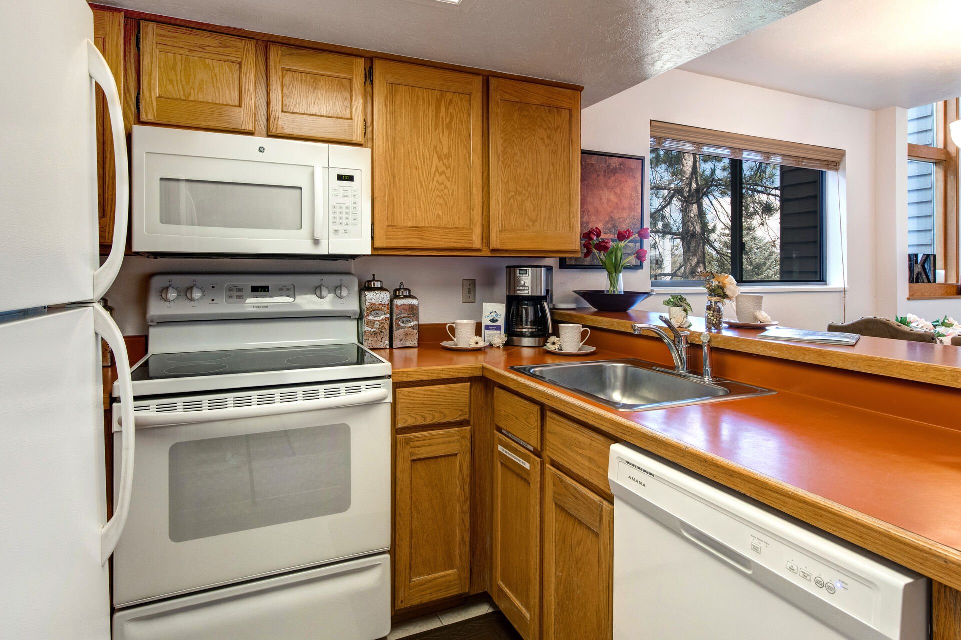 Fully Equipped Kitchen with updated appliances and bar seating for three