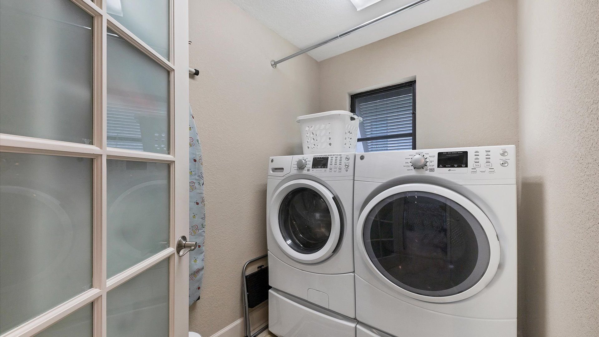 Full size washer and dryer in laundry room