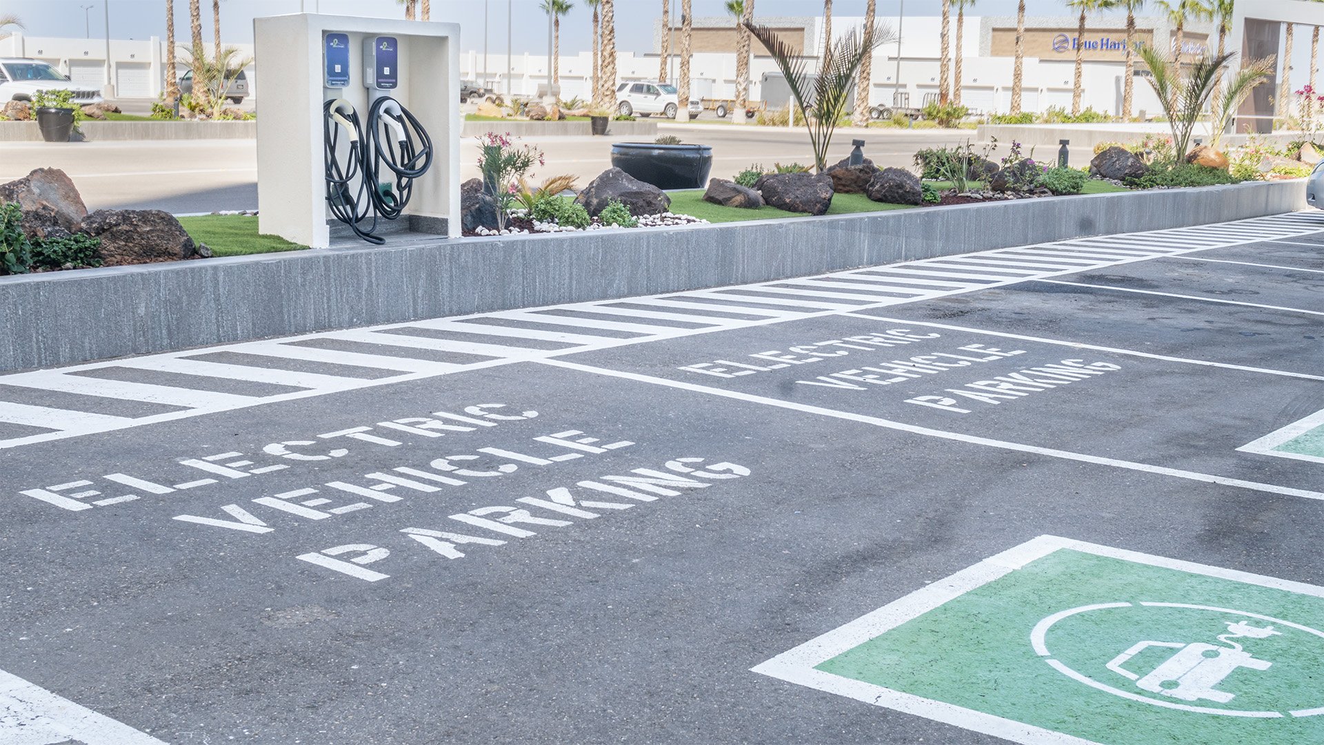 There are electric vehicle charging stations in the parking lot.