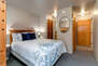 Bedroom 4 with queen bed, twin over twin bunkbed, and en suite bathroom