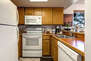 Fully Equipped Kitchen with updated appliances and bar seating for three