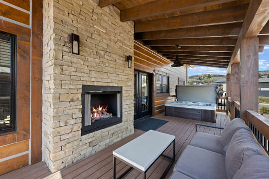 Outdoor fireplace and seating area, with a fantastic Hot Tub