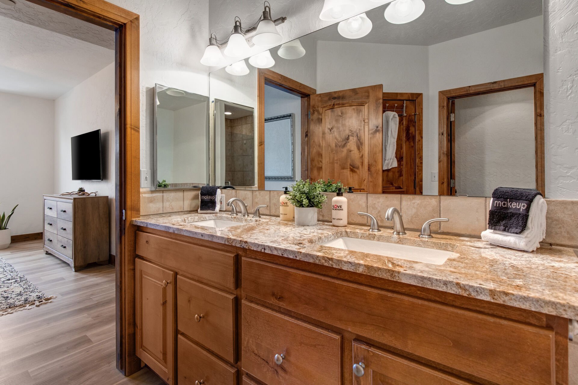 Master Bath with a Granite Countertop Vanity with Two Sinks