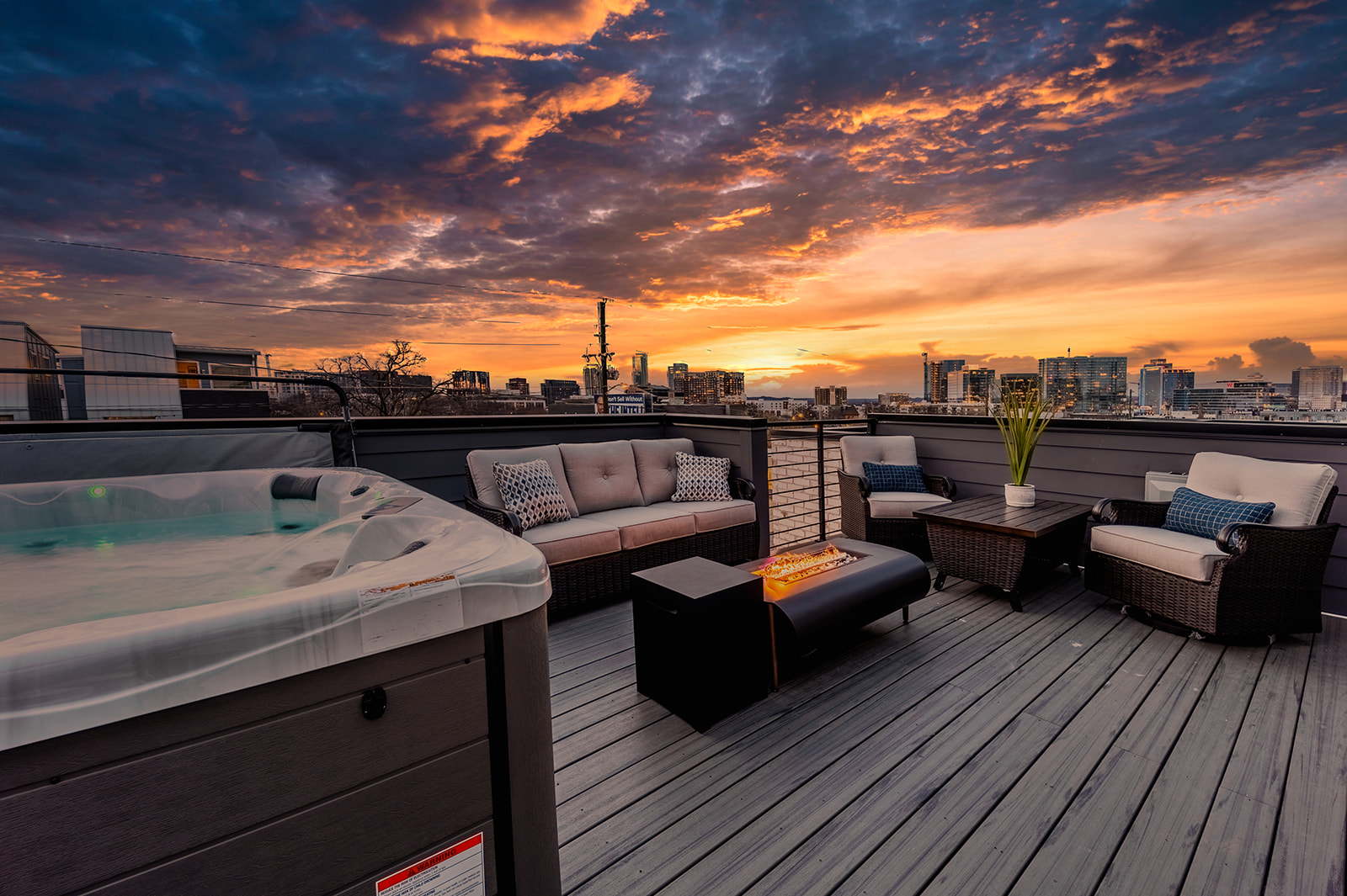 1st unit rooftop patio: Features hot tub, fire pit, outdoor bbq, and lounge area.