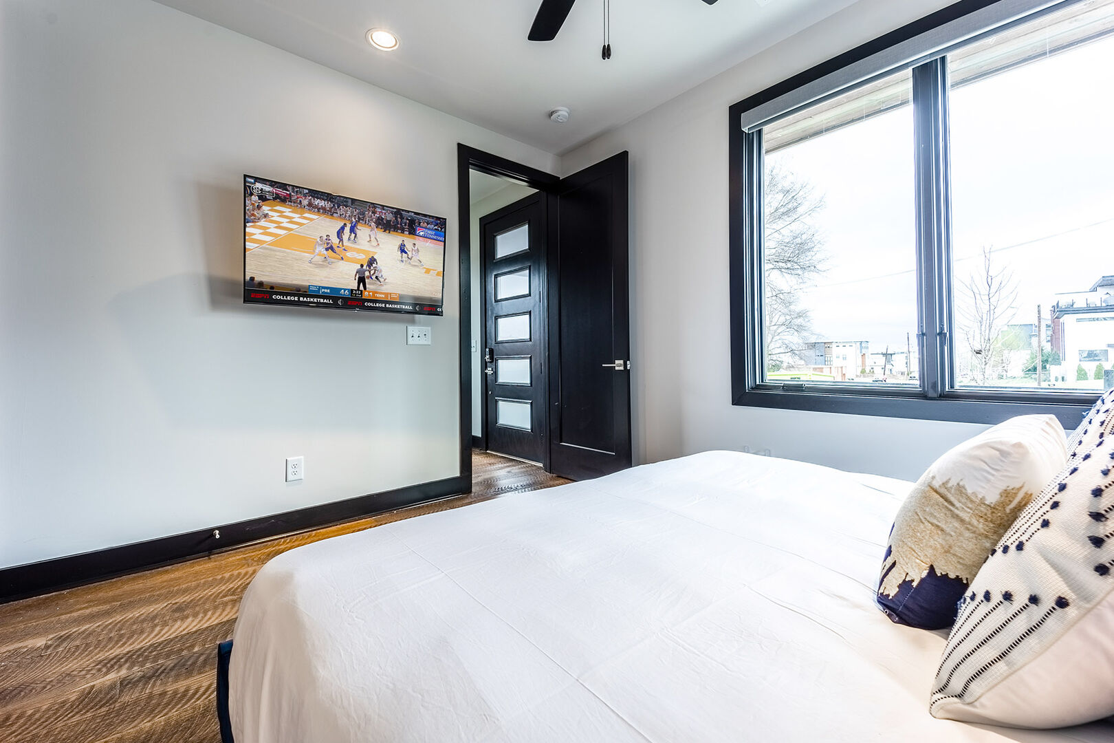 2nd unit: 4th bedroom (1st floor) with King bed, smart TV, and en-suite bathroom.