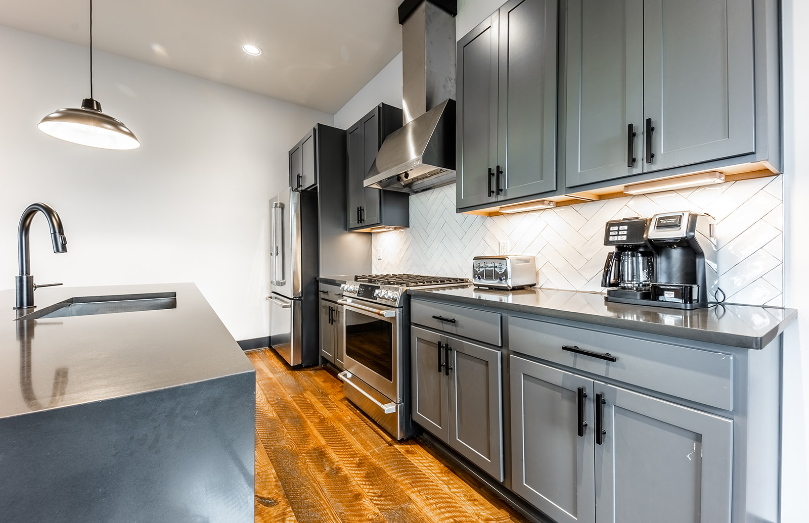 2nd unit: Gourmet style kitchen with stainless steel appliances and breakfast bar seating. Fully stocked with all your basic cooking essentials.