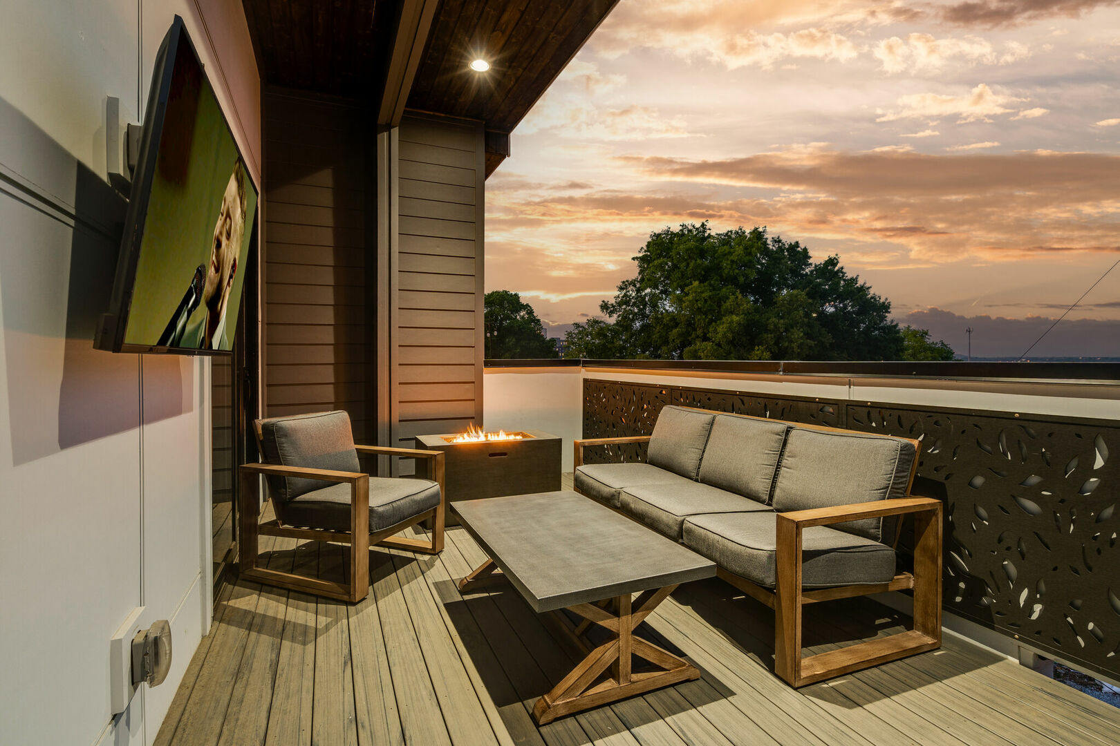 4th unit: Rooftop balcony with fire pit, smart TV, outdoor BBQ grill, and lounge area.