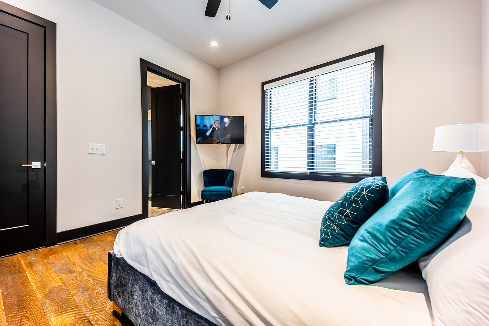 4th unit: 3rd Bedroom (2nd floor) with Queen bed, smart TV, and en-suite bathroom.