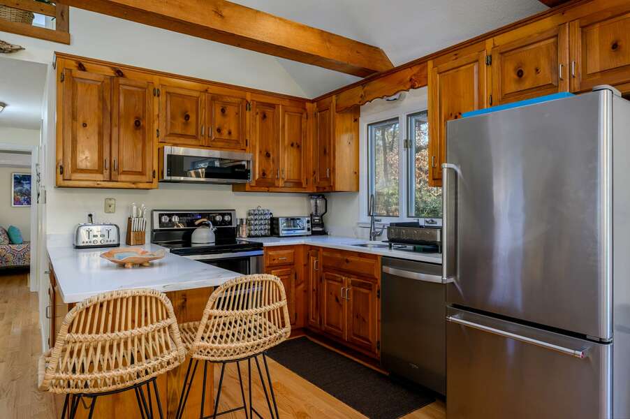 Well-appointed kitchen with modern appliances and new countertop - 1325 Bridge Road Eastham Cape Cod