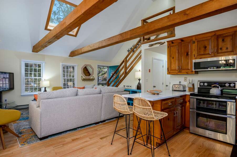 View of the kitchen and living spaces from the dining area - 1325 Bridge Road Eastham Cape Cod