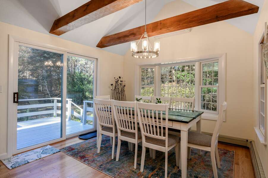 Serene views and natural light set the scene in the dining space - 1325 Bridge Road Eastham Cape Cod - Turtle Dreams - NEVR