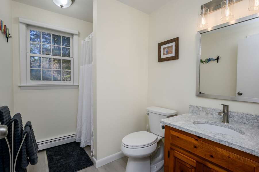 First floor hallway bathroom with lots of space and sparkling countertop - 1325 Bridge Road Eastham Cape Cod - Turtle Dreams - NEVR