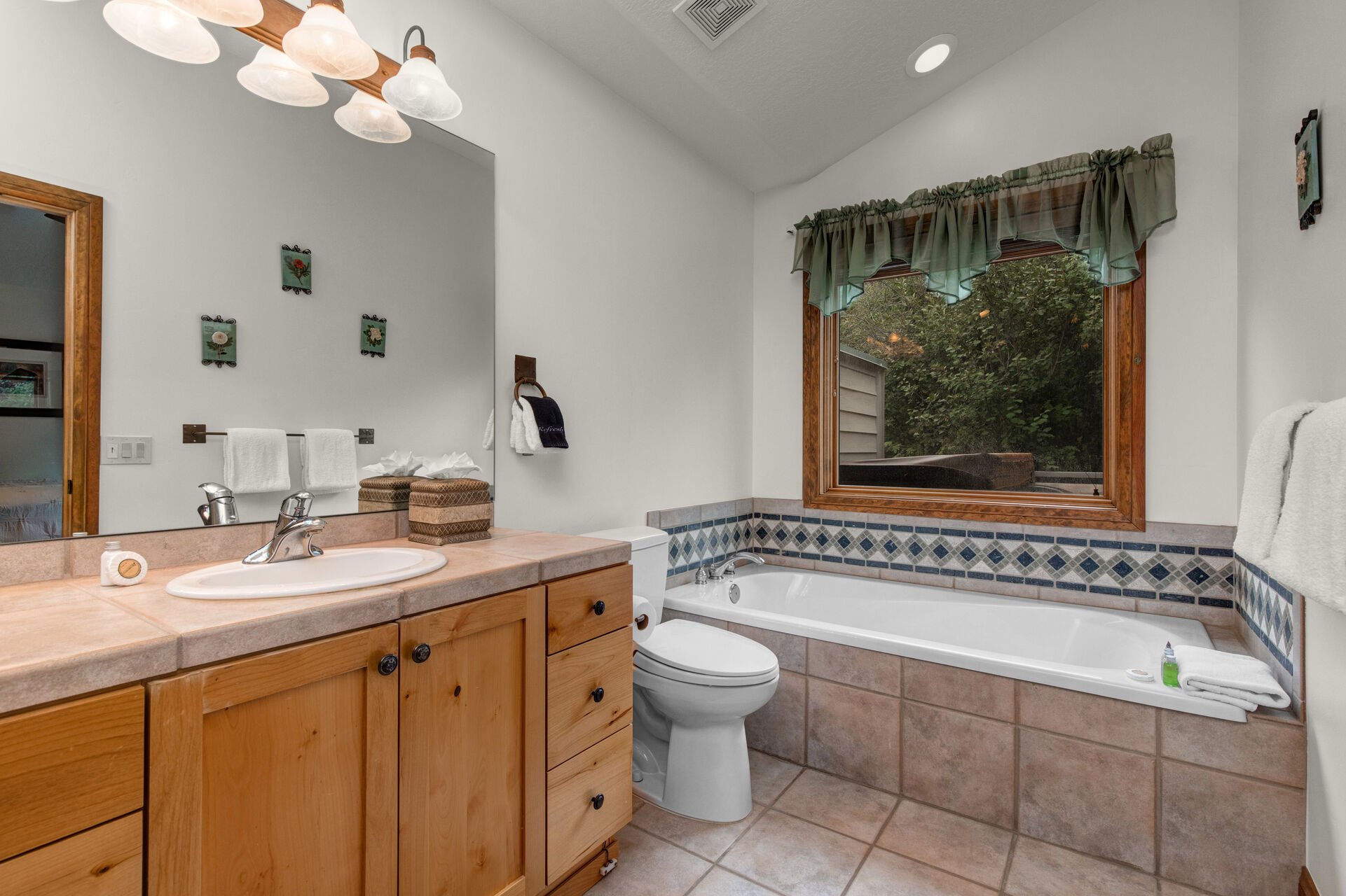 Bedroom 2 Bathroom with tub and separate tile & glass shower