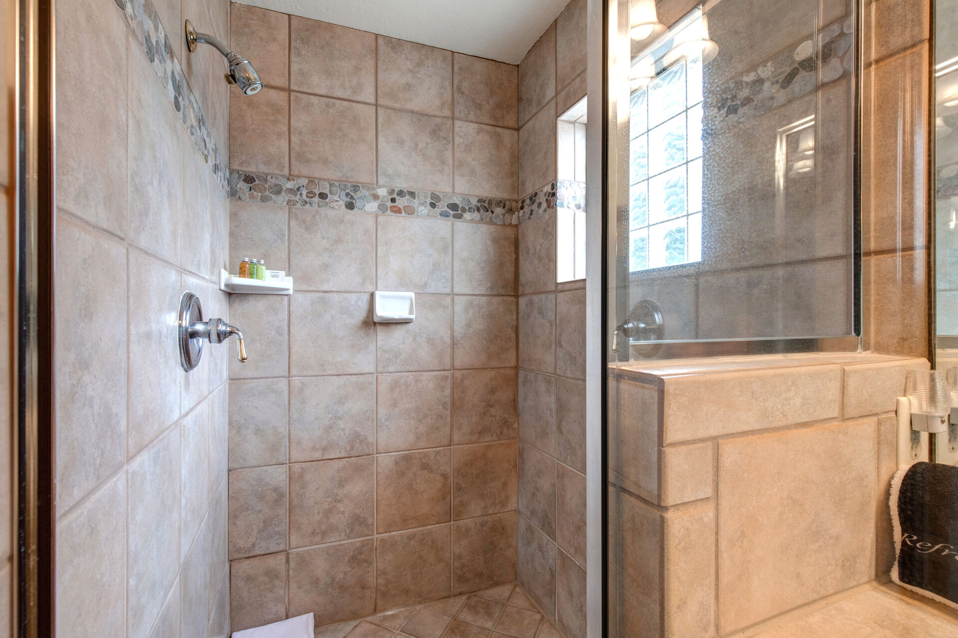 Master Bathroom with double vanities, jetted tub, and glass & tile shower