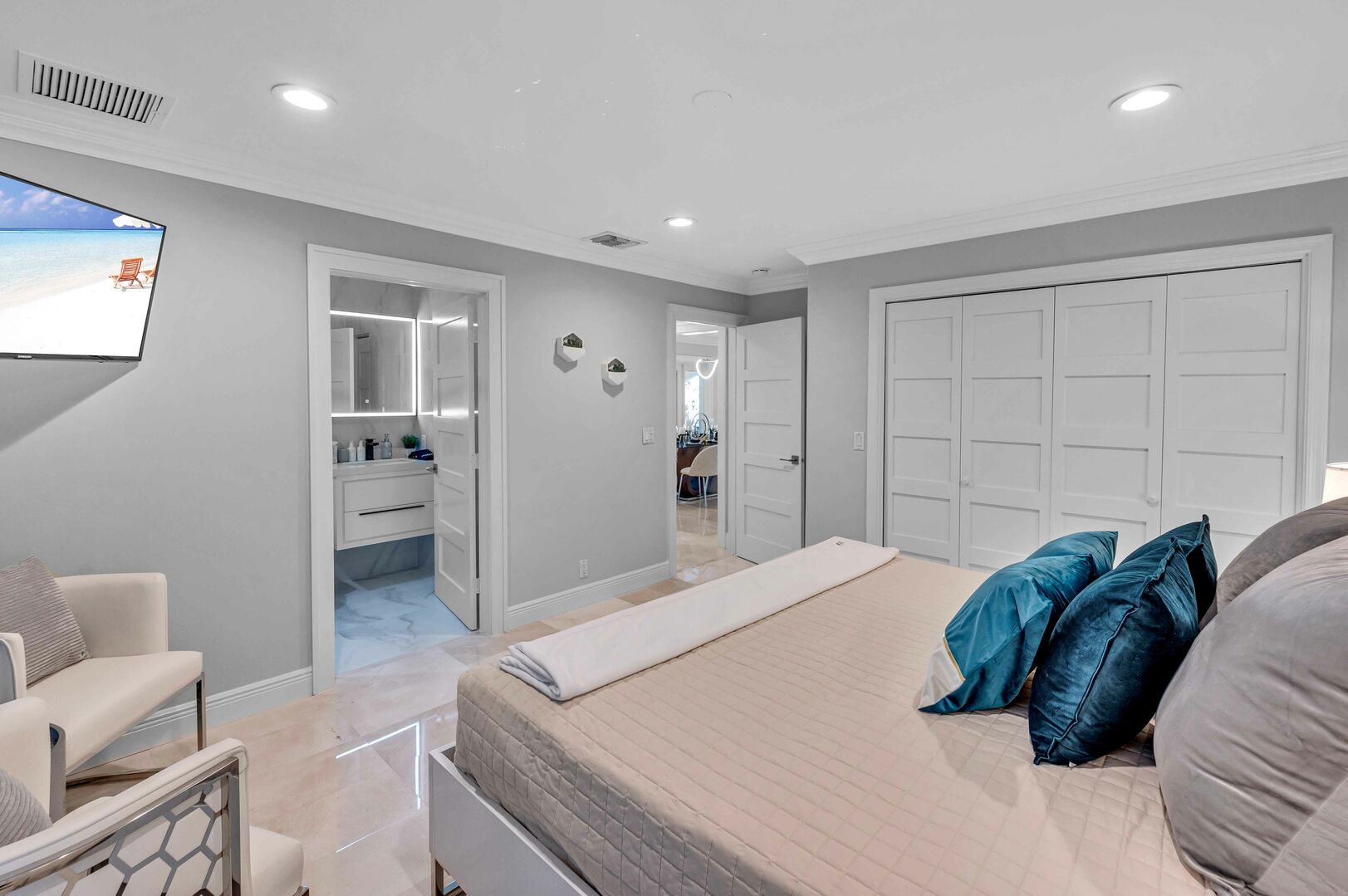 Bedroom five boasts a king bed, ensuite bathroom and smart TV.