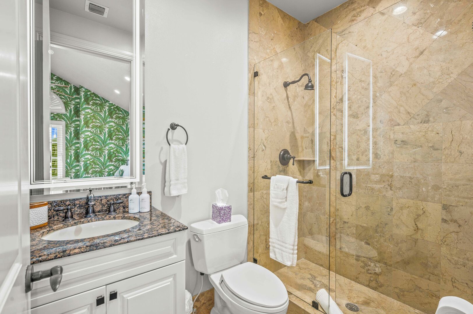 The fifth bedroom's bathroom features a walk-in shower.