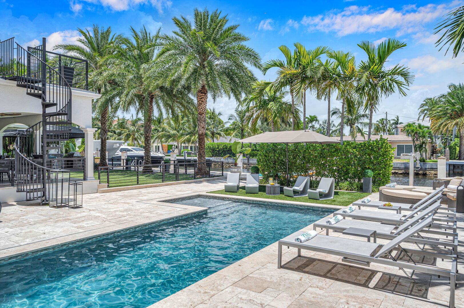 Relish in water front tranquility from the heated pool with its swim shelf and lounge areas.