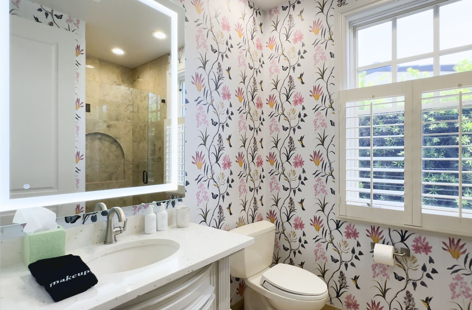 Downstairs bathroom features a walk-in shower and is conveniently located by the downstairs bedroom.