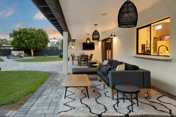 Outdoor Seating Area Overlooking Green Space & Pool