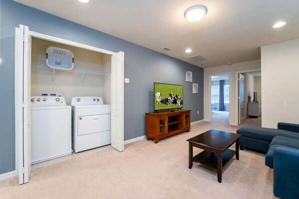 Loft seating area with laundry facilities