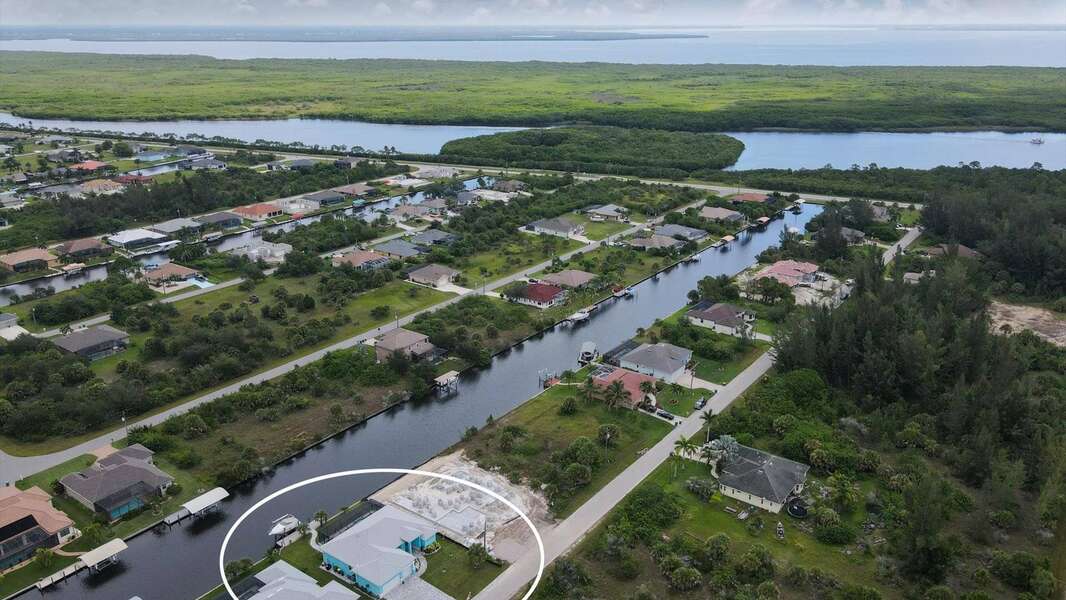 South Gulf Cove house aerial view of the canals to Charlotte harbor and the Gulf of Mexico beyond