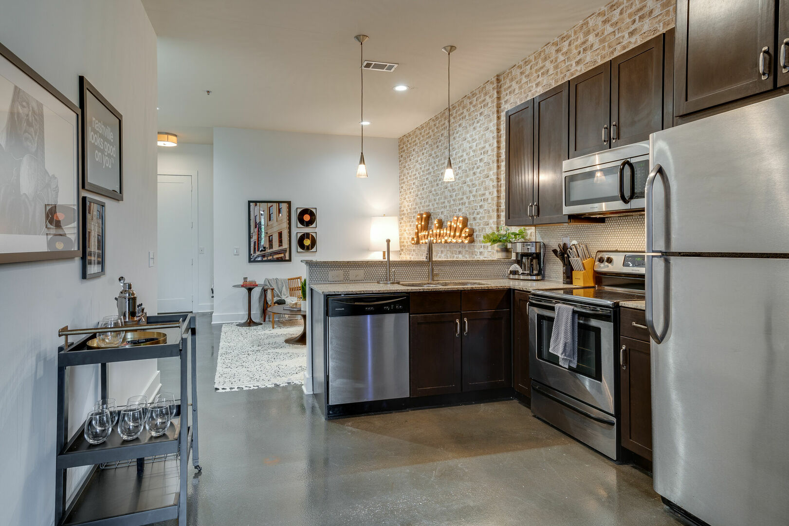 Fully equipped kitchen with stainless steel appliances stocked with your basic cooking essentials.