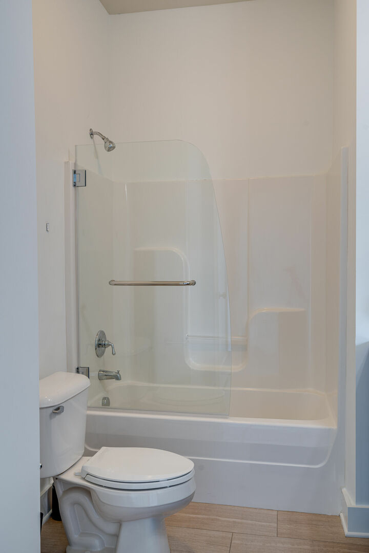 Full bathroom with shower and tub combo.