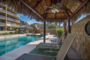 shade palapa with lounge chairs and. BBQ grill