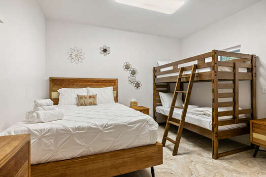 Bedroom 4 with a Queen Bed and Twin over Twin Bunk Beds