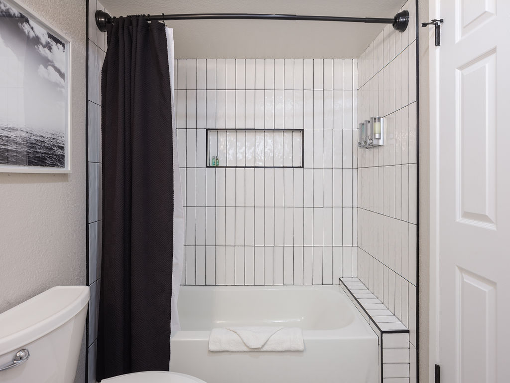 Shared bathroom with shower tub combo
